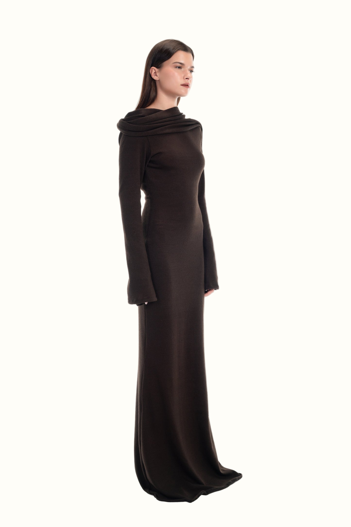 LUCE woman wearing a dark brown knit dress with scarf detail attached