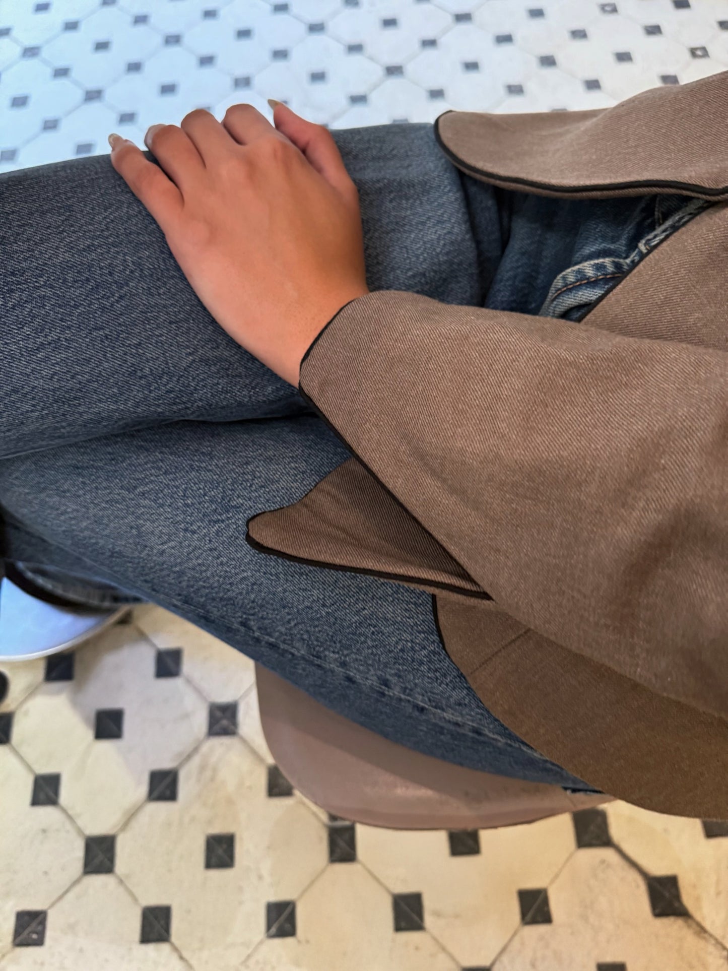 a close up of LUCE's blazer cuff