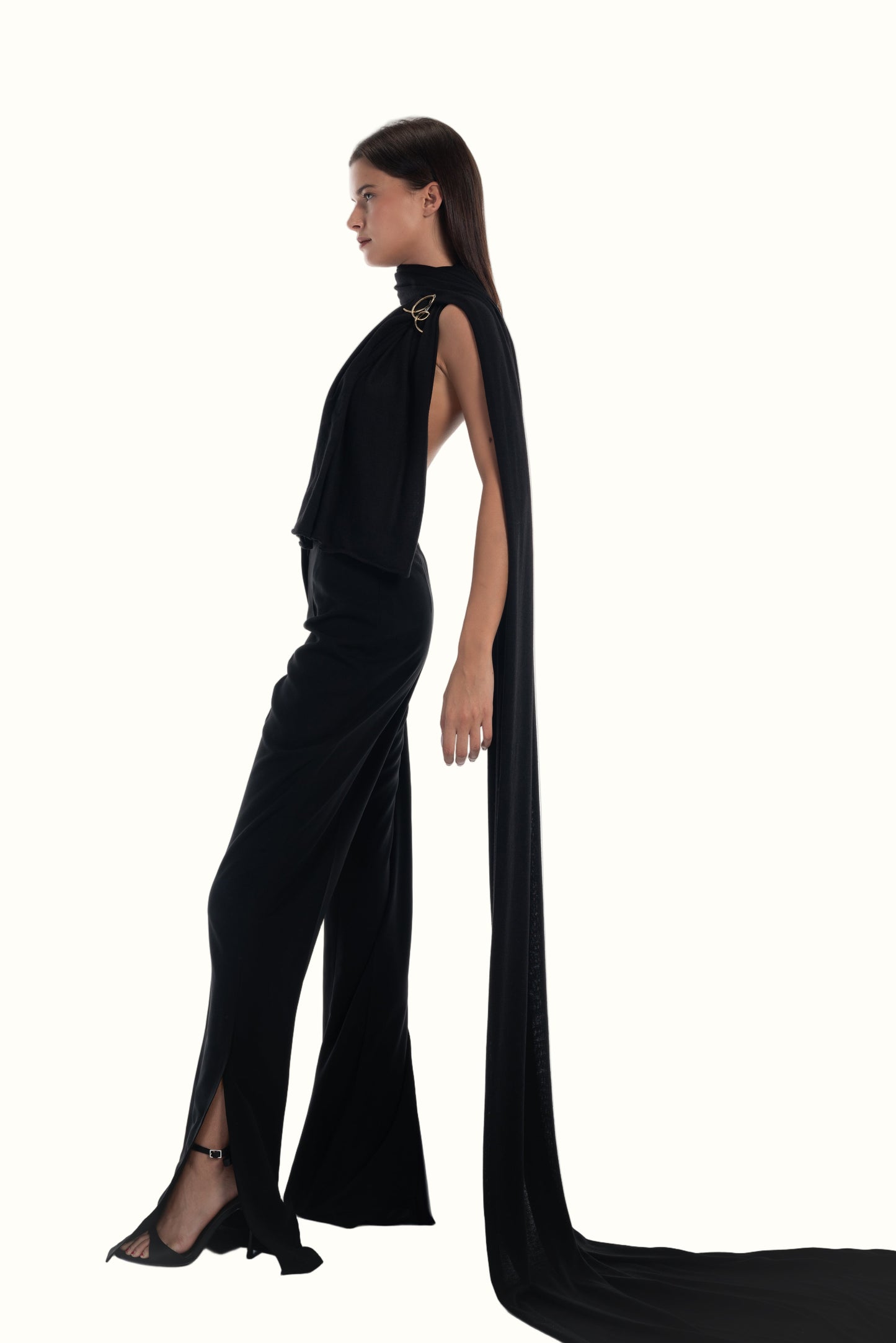 LUCE Woman wearing the long black scarf with brooch. a long cape on a white background