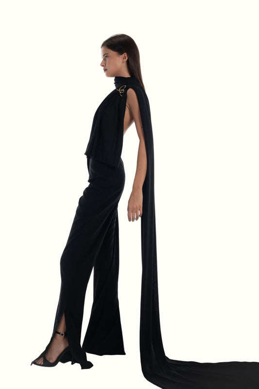 LUCE Woman wearing the long black scarf with brooch. a long cape on a white background