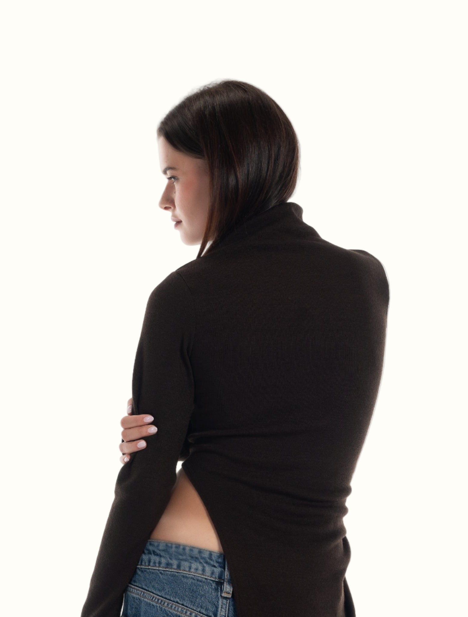 LUCE gen Z girl wearing a black long-sleeve top and blue jeans on a white background