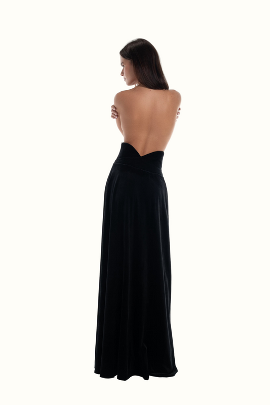 LUCE Woman wearing a black evening velvet skirt with a high waist on a white background