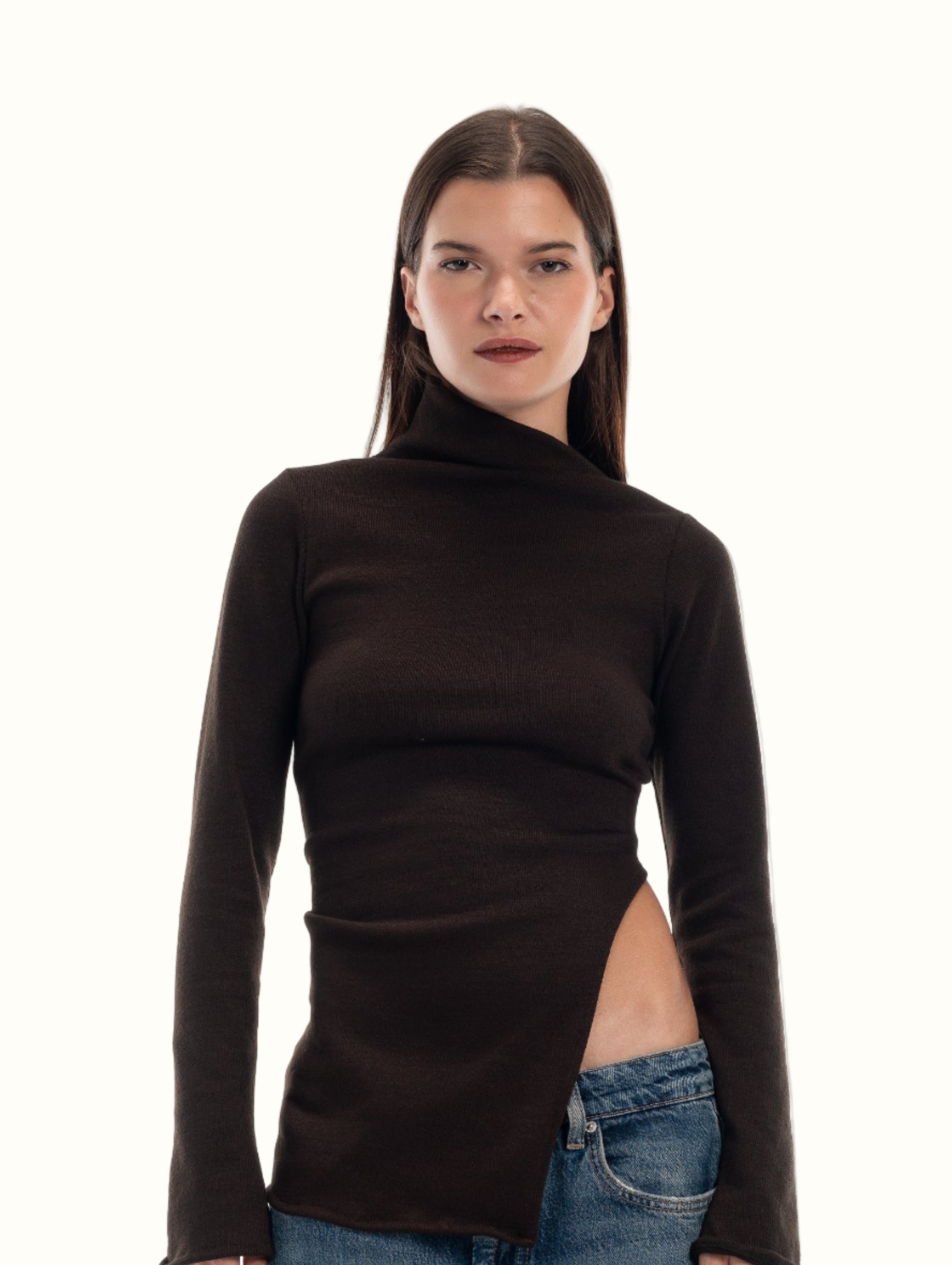 LUCE Woman wearing a black turtleneck and blue jeans on a white background