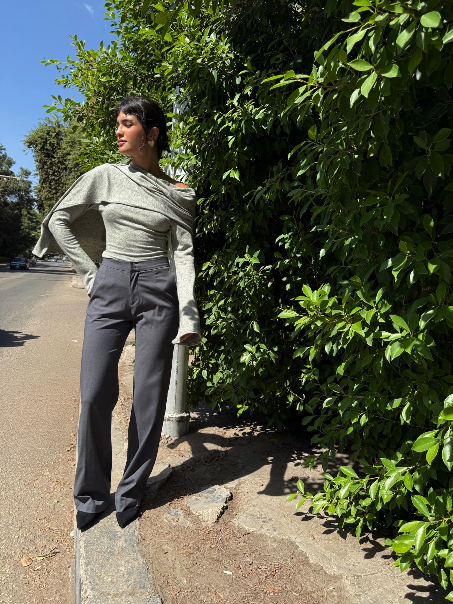 LUCE girl wearing grey tailored pants